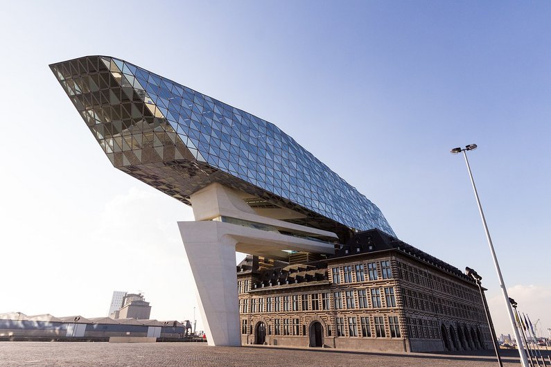 Old building with modern construction with glass façade above