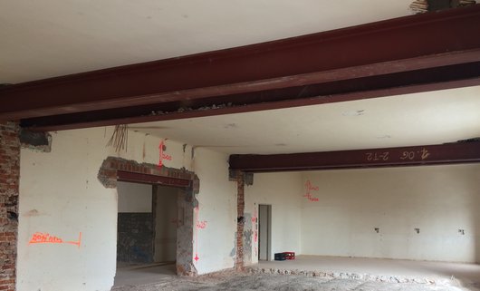 Internal supporting walls had to be removed from the large dining hall and the ceilings underpinned with steel beams.