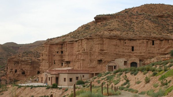 Flats built into a brown-reddish rock