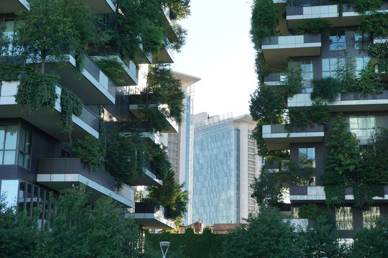 The Bosco Verticale residential complex in Milan with modern high-rise buildings with lush vertical gardens on the balconies.