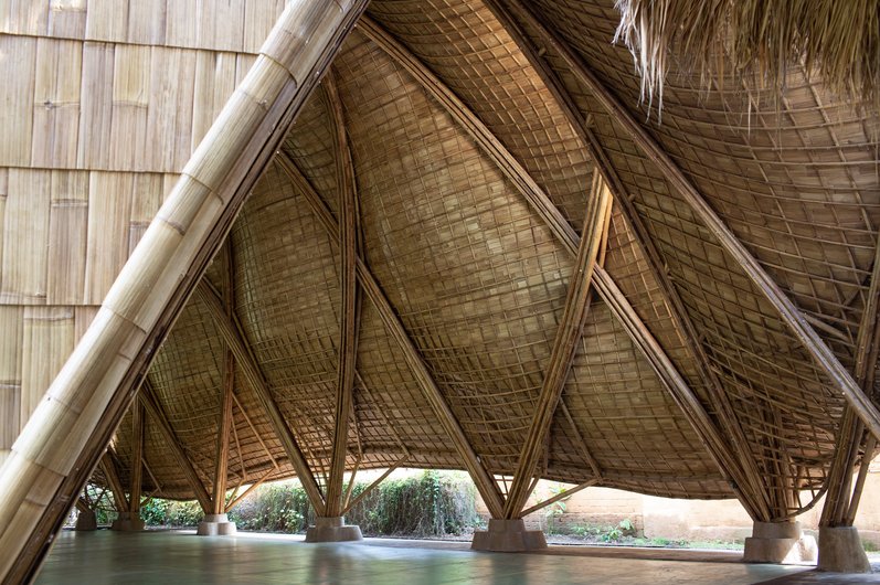 A bamboo structure with slanted walls and an open design.